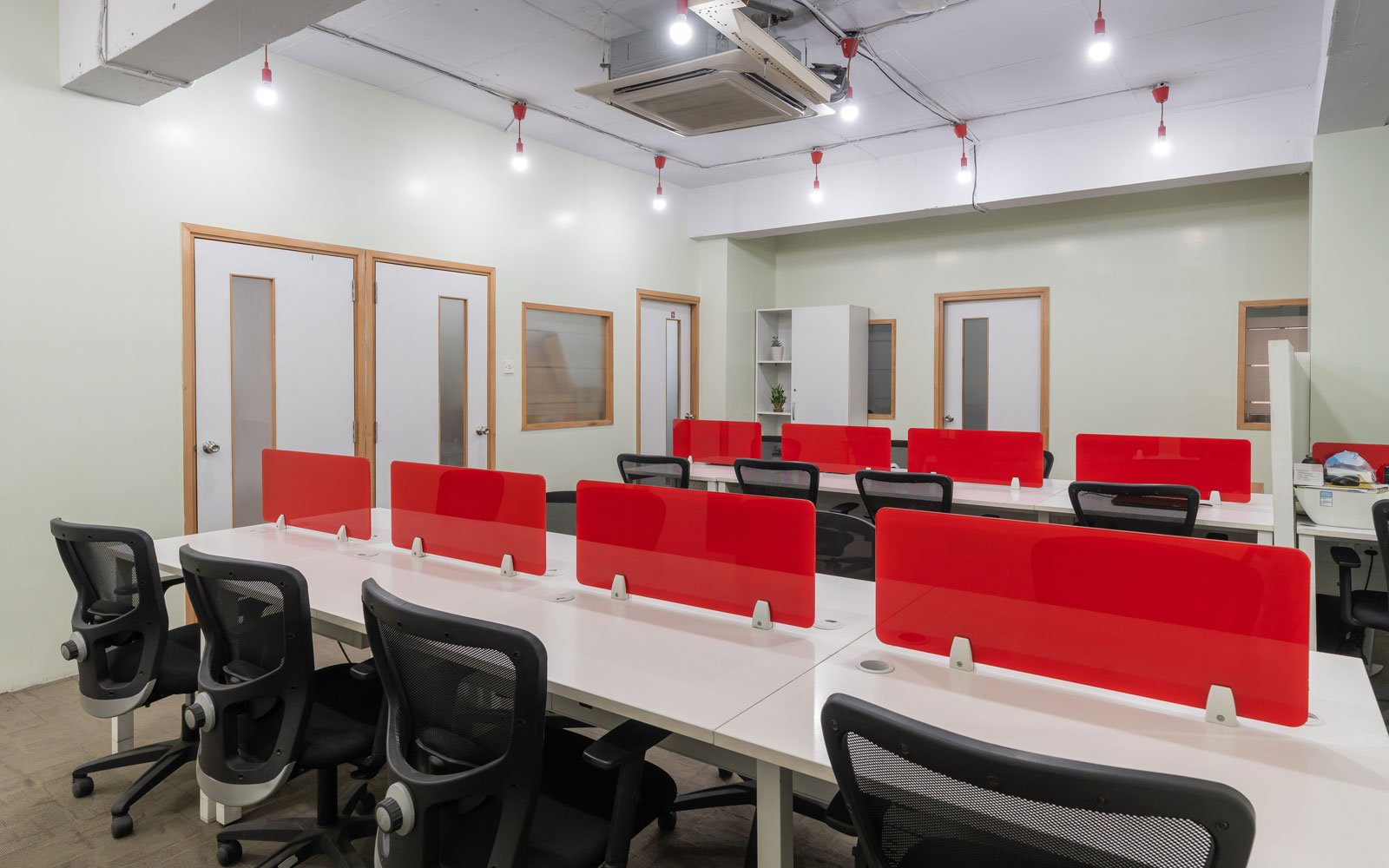 Modern workspace with red privacy screens